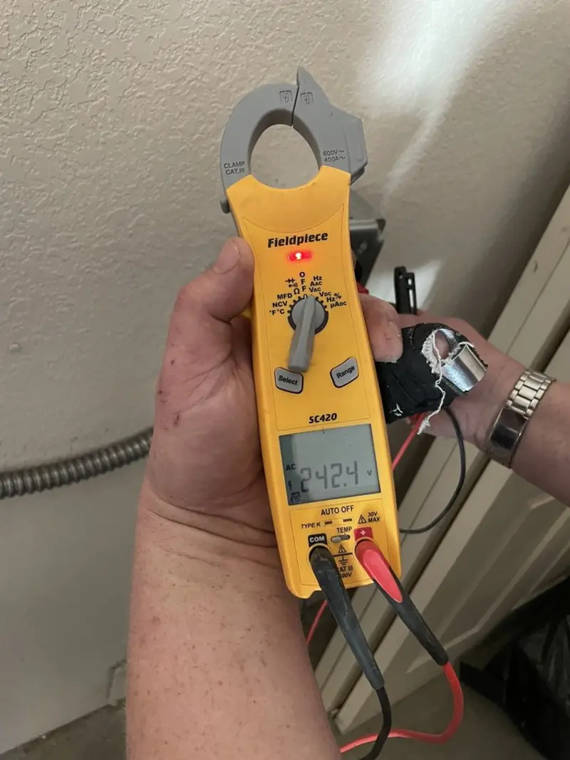 Voltage testing with clamp meter during Electrical Installation Services in Bonne Terre